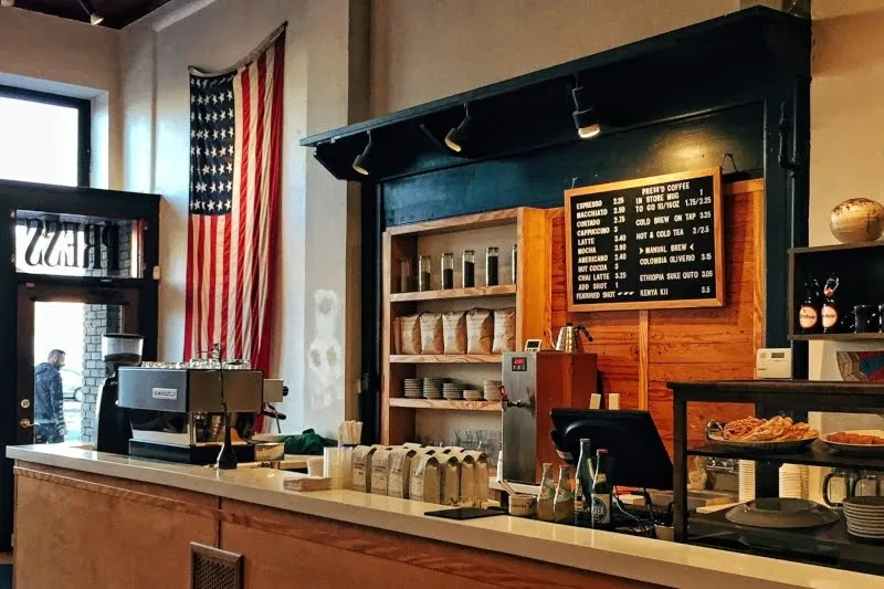 interior of a coffee shop with coffee grinding service for free