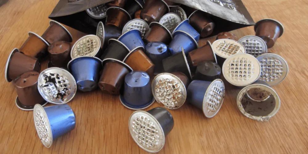 Old Nespresso coffee pods in a pile